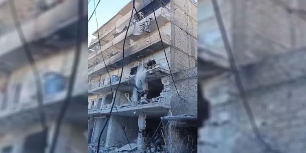 Halep’te insanlık suçu, ölen kadın savaşçı binadan atıldı
